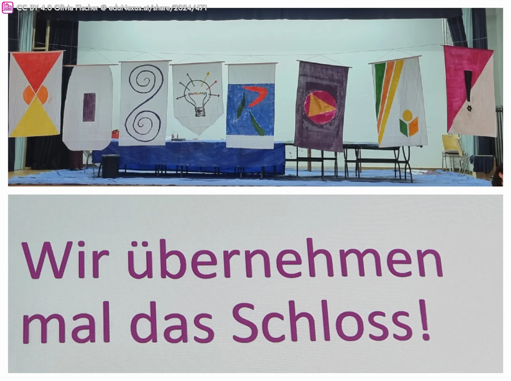 Bunte Banner mit geometrischen Mustern hängen an einer Wand; darunter ein Schild mit der Aufschrift „Wir übernehmen mal das Schloss!“.